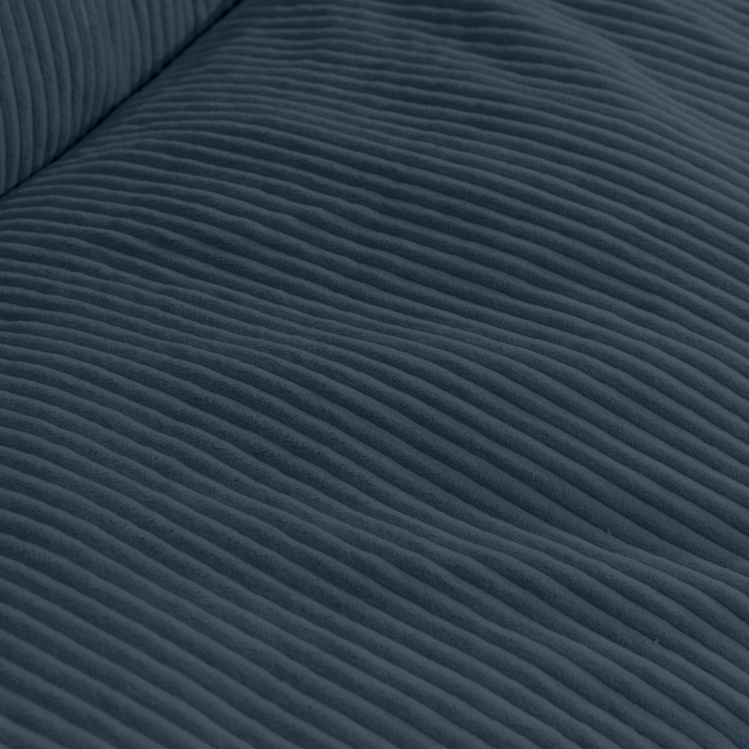 Gros plan du tissu en velours côtelé épais du pouf