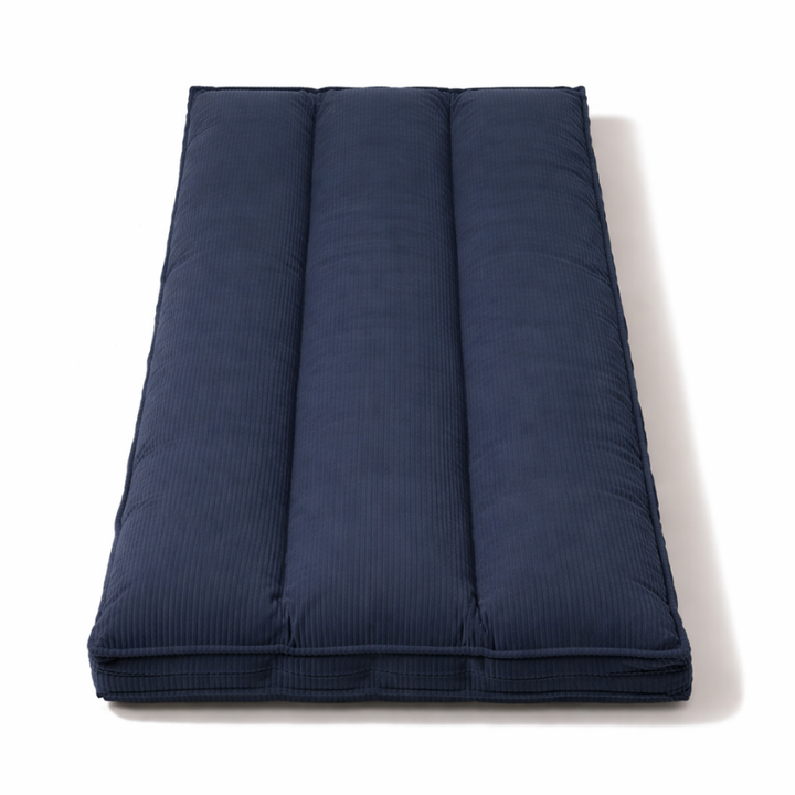 Futon déhoussable bleu foncé, vue de dessus, trois panneaux matelassés.