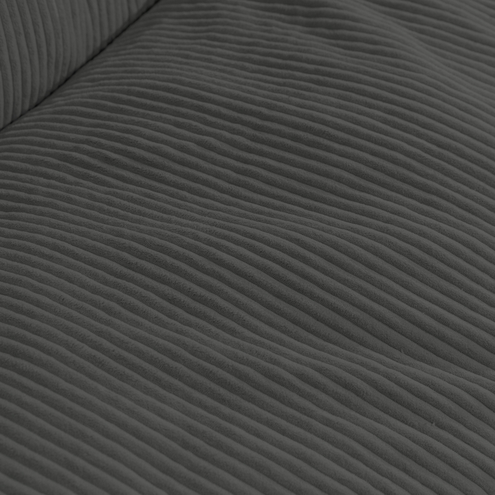Gros plan du tissu en velours côtelé épais du pouf