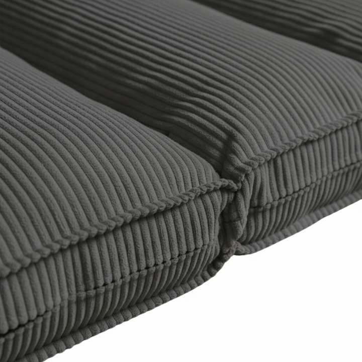 Housse de futon déhoussable en velours côtelé gris foncé, gros plan sur la texture côtelée.