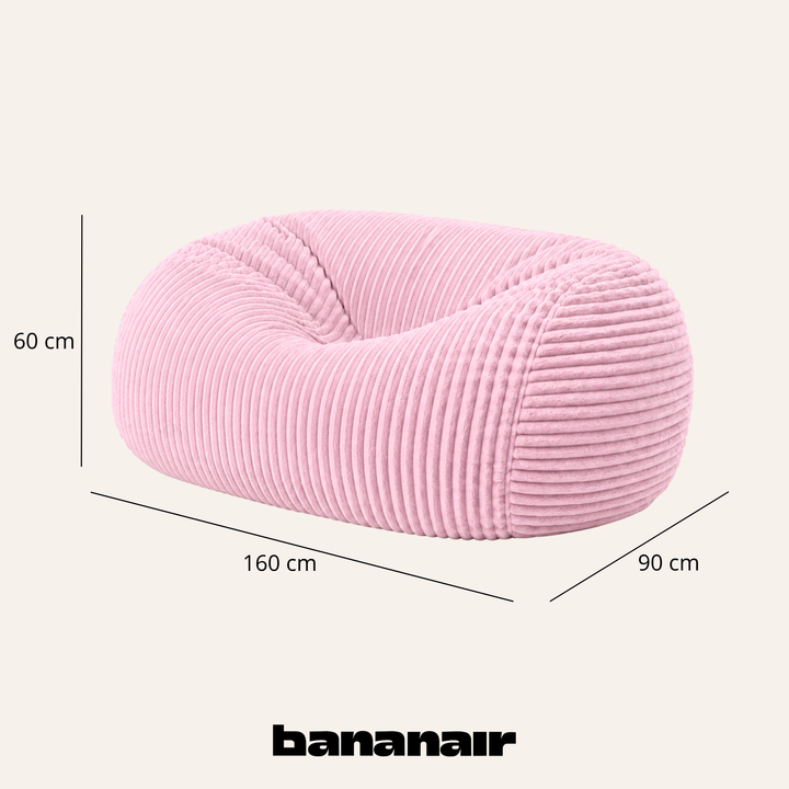 Pouf long géant déhoussable en fourrure côtelée rose, dimensions indiquées 160x90x60 cm