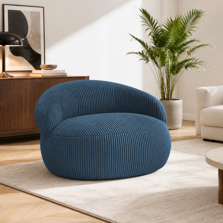 Pouf XXL déhoussable en velours côtelé, forme arrondie, dans un salon