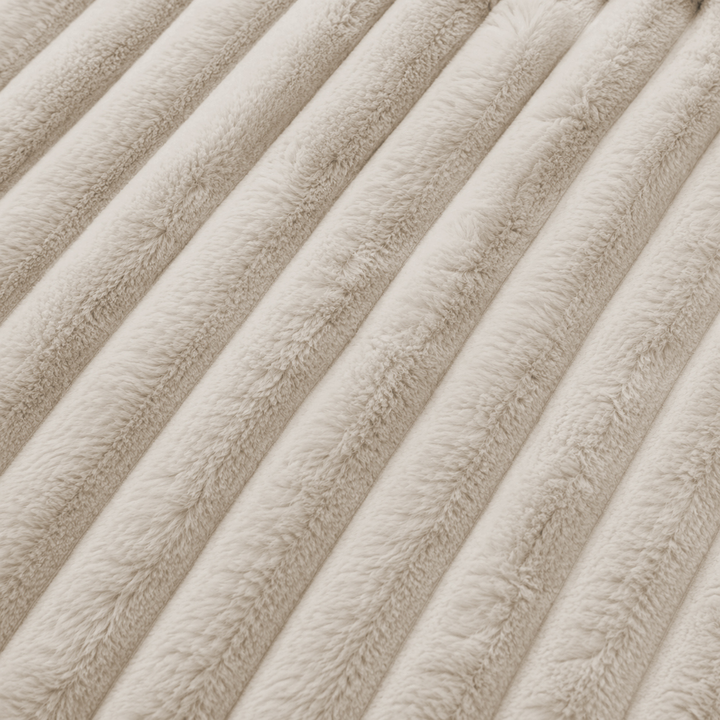 Tissu de fourrure côtelée beige, relief vertical du module central déhoussable.
