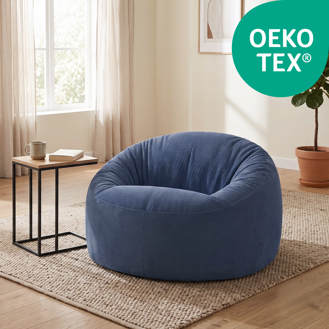 Pouf déhoussable rond en velours côtelé bleu foncé avec certification OEKO-TEX®.