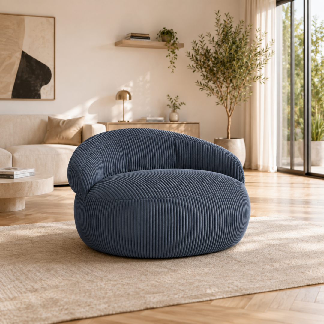 Pouf XXL déhoussable en velours côtelé, forme arrondie, dans un salon